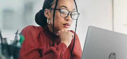 A person looking at an HP ProBook 445 G11 Notebook PC 