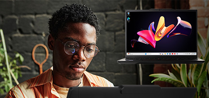 A person working at a computer superimposed with a picture of a Lenovo ThinkPad T14s 